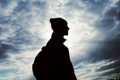 Silhouette of man against cloudy sky