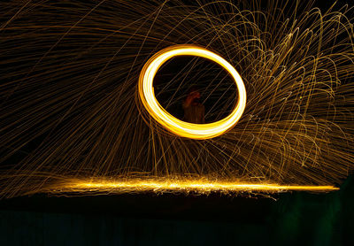 Low angle view of light painting at night