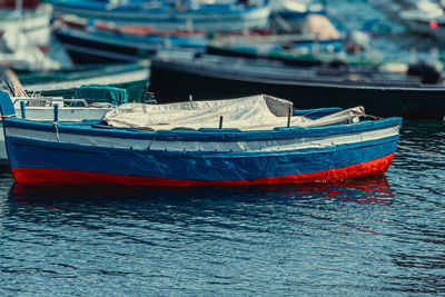 Fishing boats moored in sea