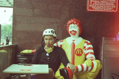 High angle view of man and woman standing in restaurant