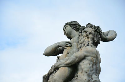 Low angle view of statue against sky