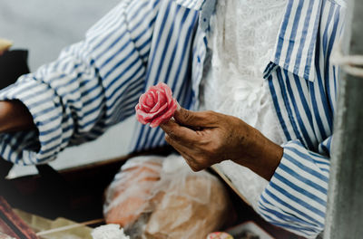 Close-up of man holding ice cream