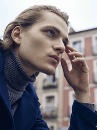 Portrait of young man looking away