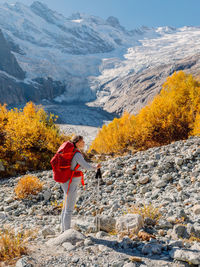 Rear view of woman walking on mountain