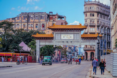 People walking on street in city