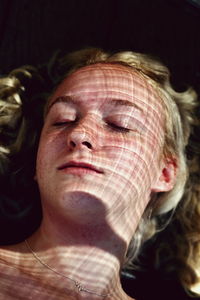 Close-up of woman with shadow on face