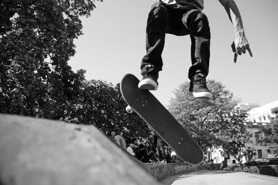 Low section of man skateboarding on skateboard