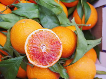 Close-up of orange fruits in box