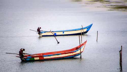 High angle view of man sitting in river