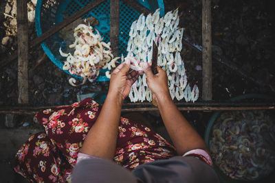 Low section of woman holding ice cream