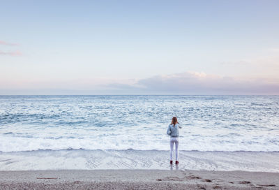 Man looking at sea against sky