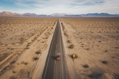 Panoramic view of road passing through desert