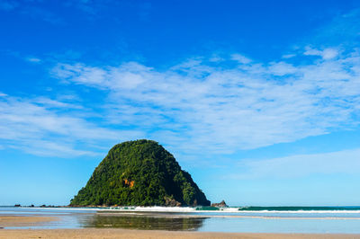 Scenic view of sea against blue sky