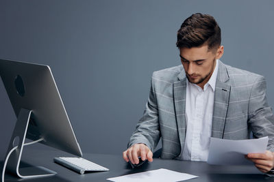 Businessman working at desk in office