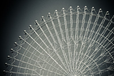 Low angle view of ferris wheel against sky at night