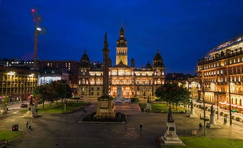 Illuminated buildings in city at night