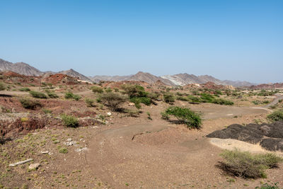 Scenic view of arid landscape against clear sky