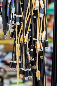 Close-up of electric equipment hanging for sale in store