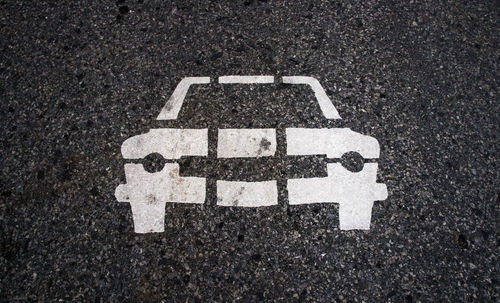 High angle view of arrow sign on road