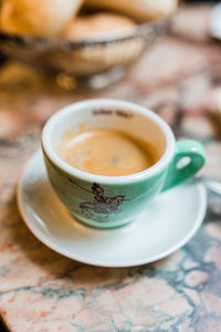 Close-up of coffee cup on table