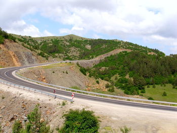 Scenic view of landscape against cloudy sky