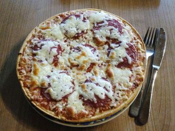 High angle view of pizza in glass on table