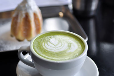 Close-up of coffee cup on table