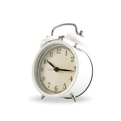 Close-up of clock over white background