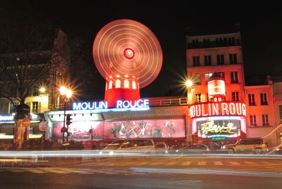 Illuminated building in city at night