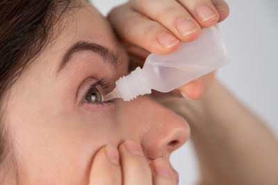 Cropped image of woman holding dental equipment