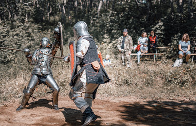 View of warrior standing on field