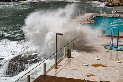 High angle view of waves splashing water