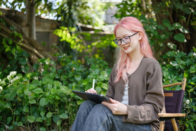 Young woman using mobile phone