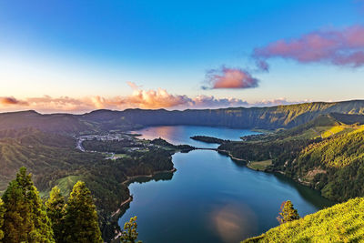 Scenic view of mountains against sky at sunset