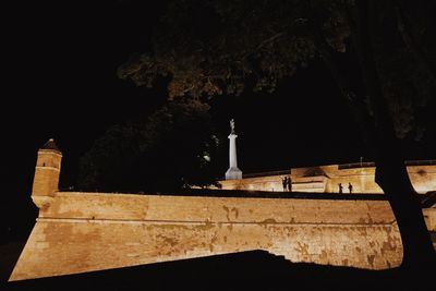 Cross in temple at night