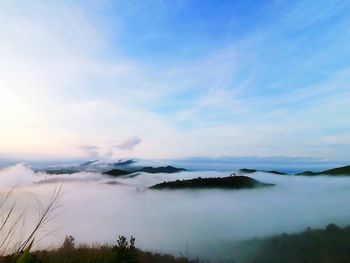 Scenic view of landscape against blue sky