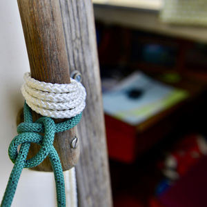 Close-up of rope tied on wooden post