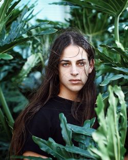 Portrait of beautiful young woman with leaves