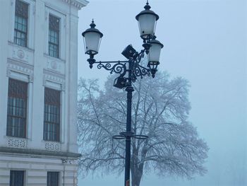 Low angle view of street light against sky