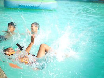 Man swimming in pool