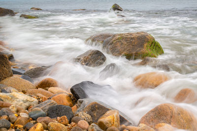Scenic view of rocks at sea shore