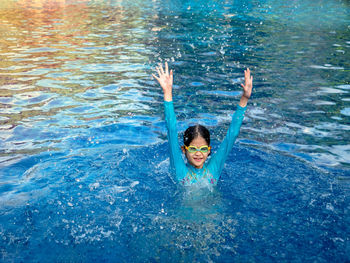 High angle view of woman swimming in pool