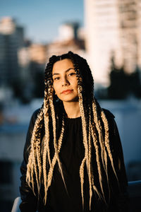 Portrait of young woman standing outdoors
