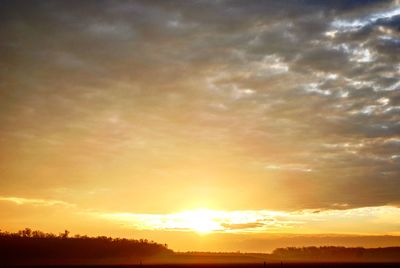 Scenic view of dramatic sky during sunset