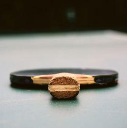 Close-up of table tennis racket on table