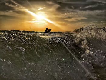 Scenic view of sea at sunset