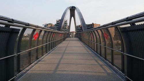 View of footbridge against clear sky