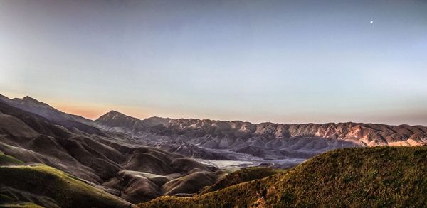 Scenic view of landscape against sky during sunset