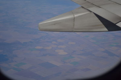 Airplane wing against sky