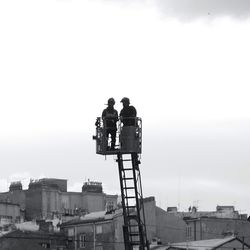 Woman standing against sky